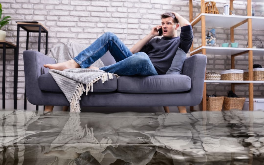 Man On The Phone In Flooded Apartment